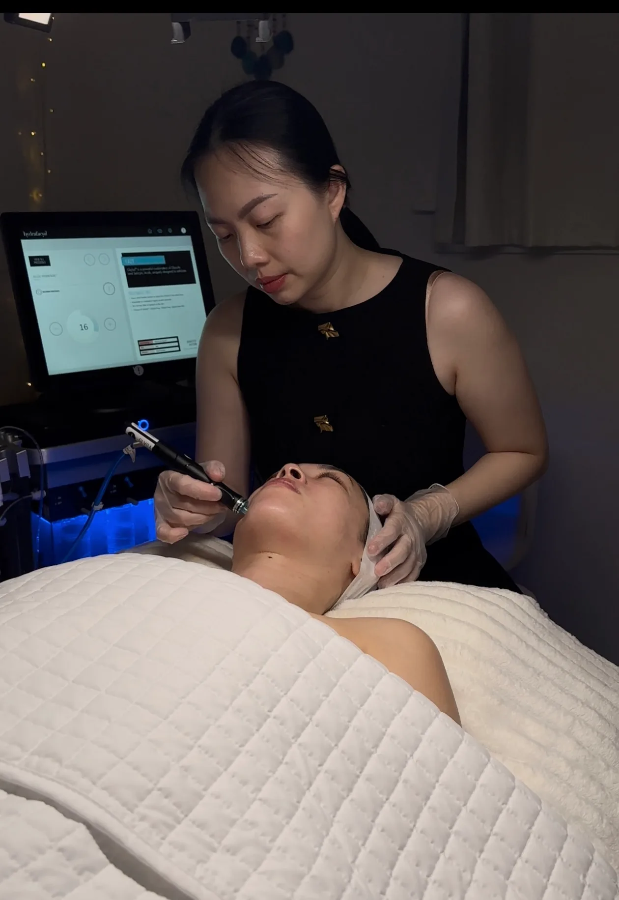 Phuong Dang treating a client at SORA Skin & Ritual House, serving Phoenix, Arizona